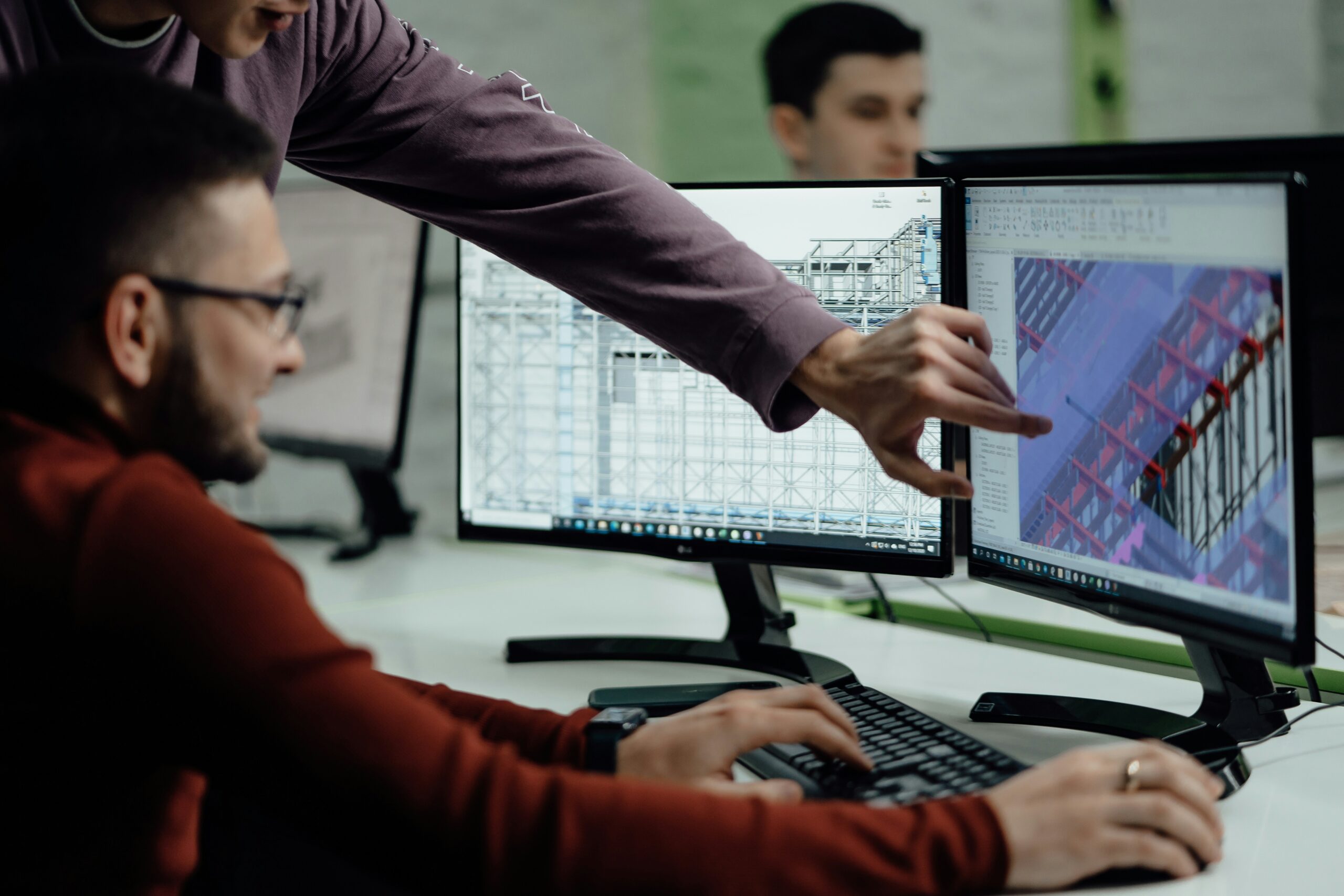 Trainer guiding architect through Revit workflow during BIM training session